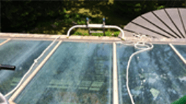Exterior windows heavily soiled with grime, bird droppings, and road runoff before cleaning